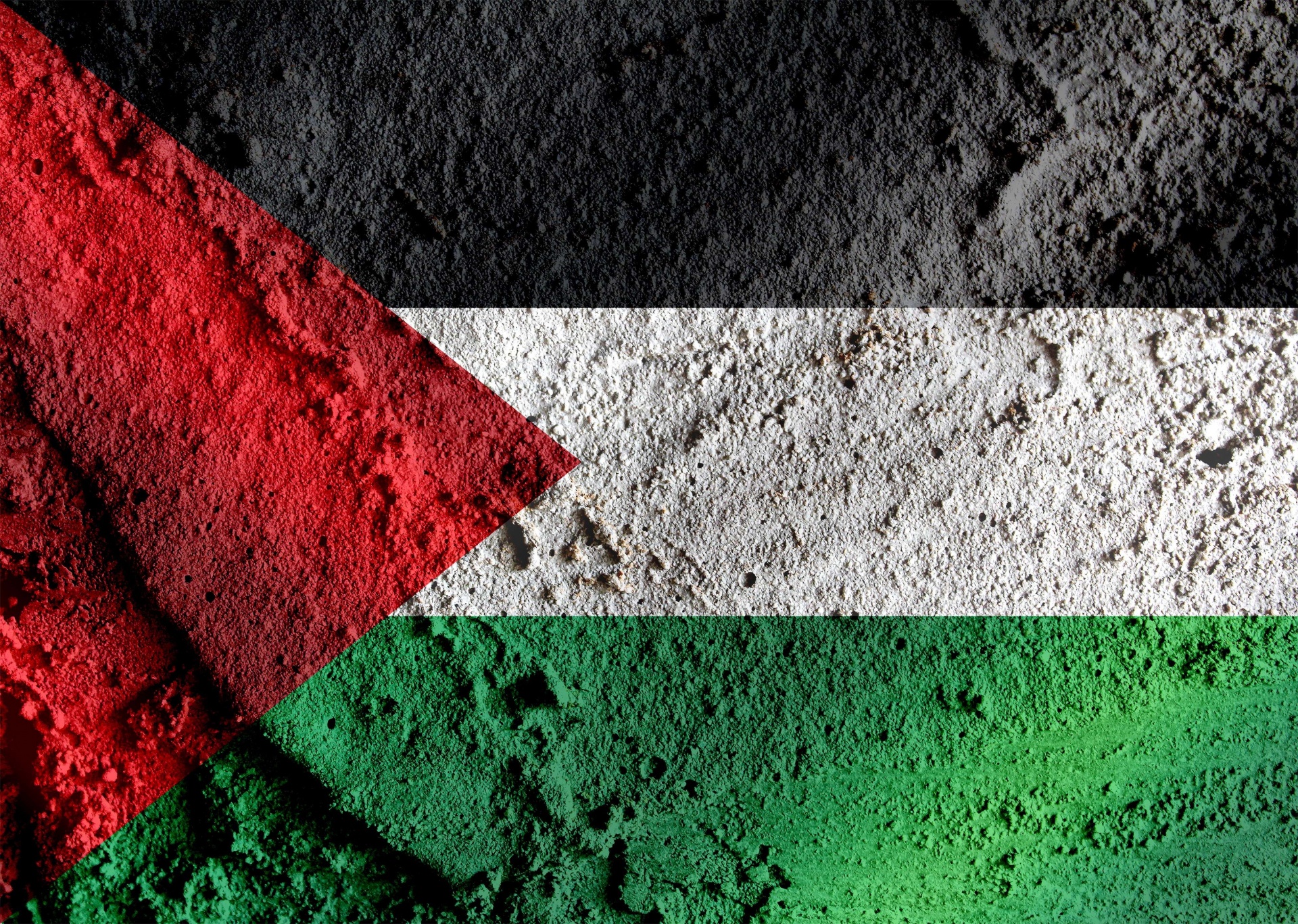 Palestinian flag overlaying an aerial photo of Gaza